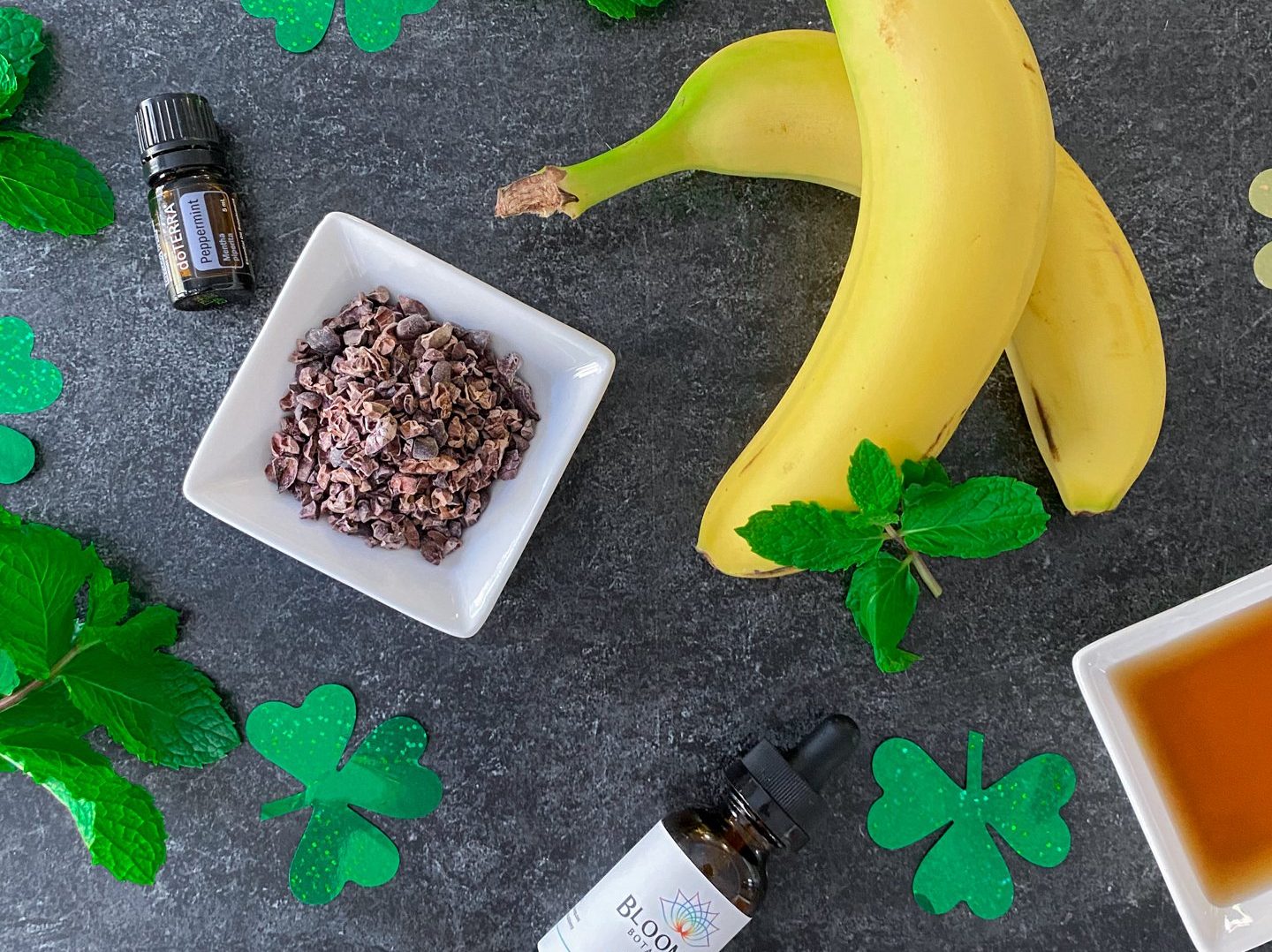 7 ingredients for CBD shamrock shake recipe including banana, cacao nibs, peppermint extract, CBD, maple