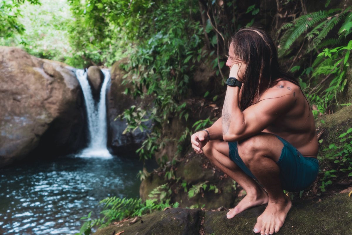 man enjoying scenic Costa Rican waterfall