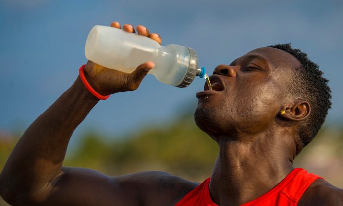 Man recovering from a run with a cbd post recovery workout drink